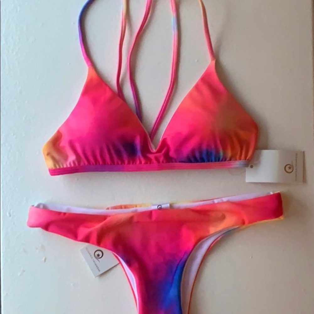 Plumeria bikini in tie-dye. Never worn! Bottoms size medium top size 32-34DD